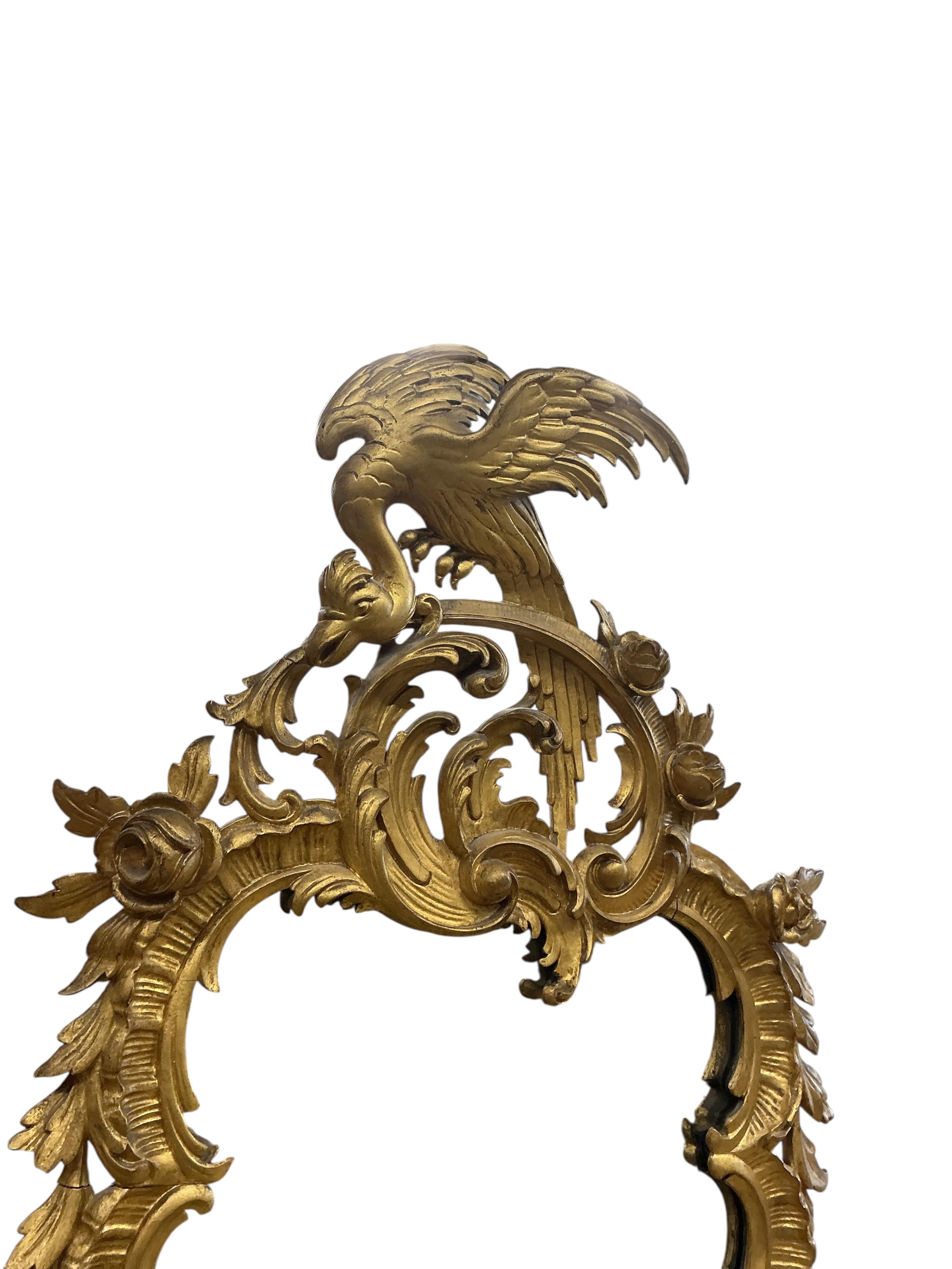 An 18th century style carved giltwood wall mirror, width 64cm, height 128cm